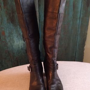 Knee high leather boots.